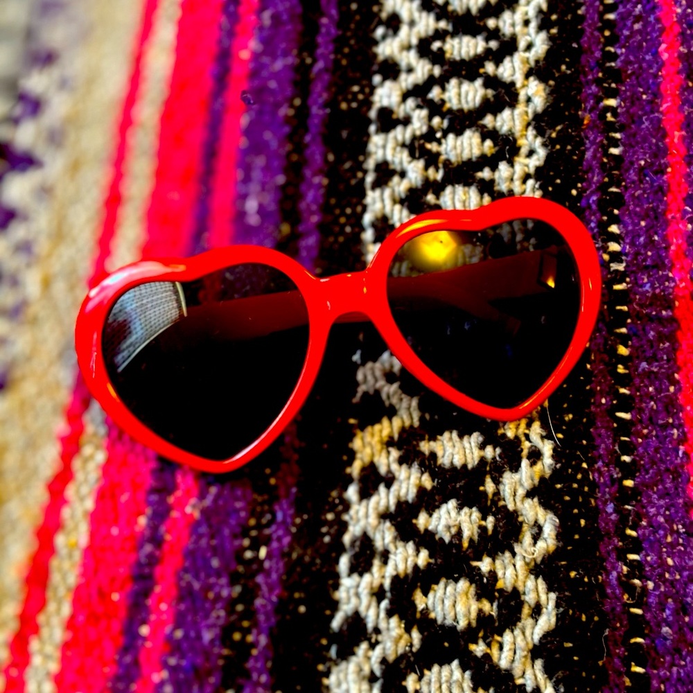 Taylor Swift red heart shaped glasses.